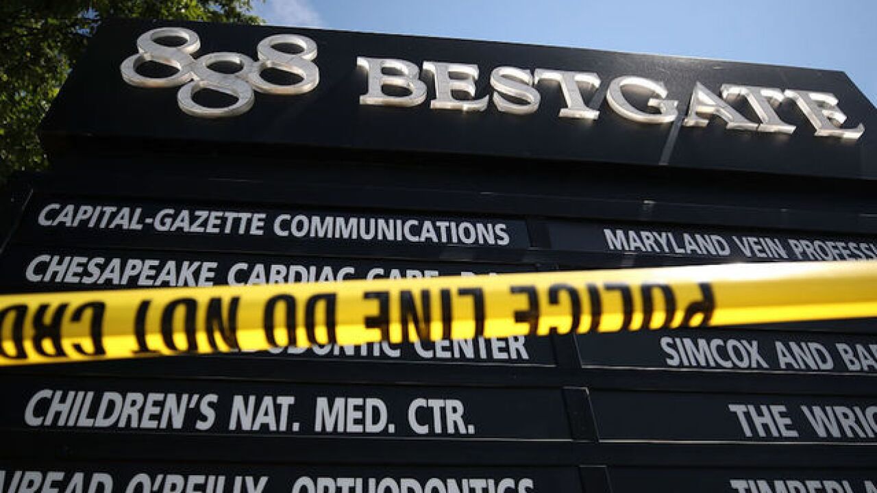 Newspaper killing suspect held without bond