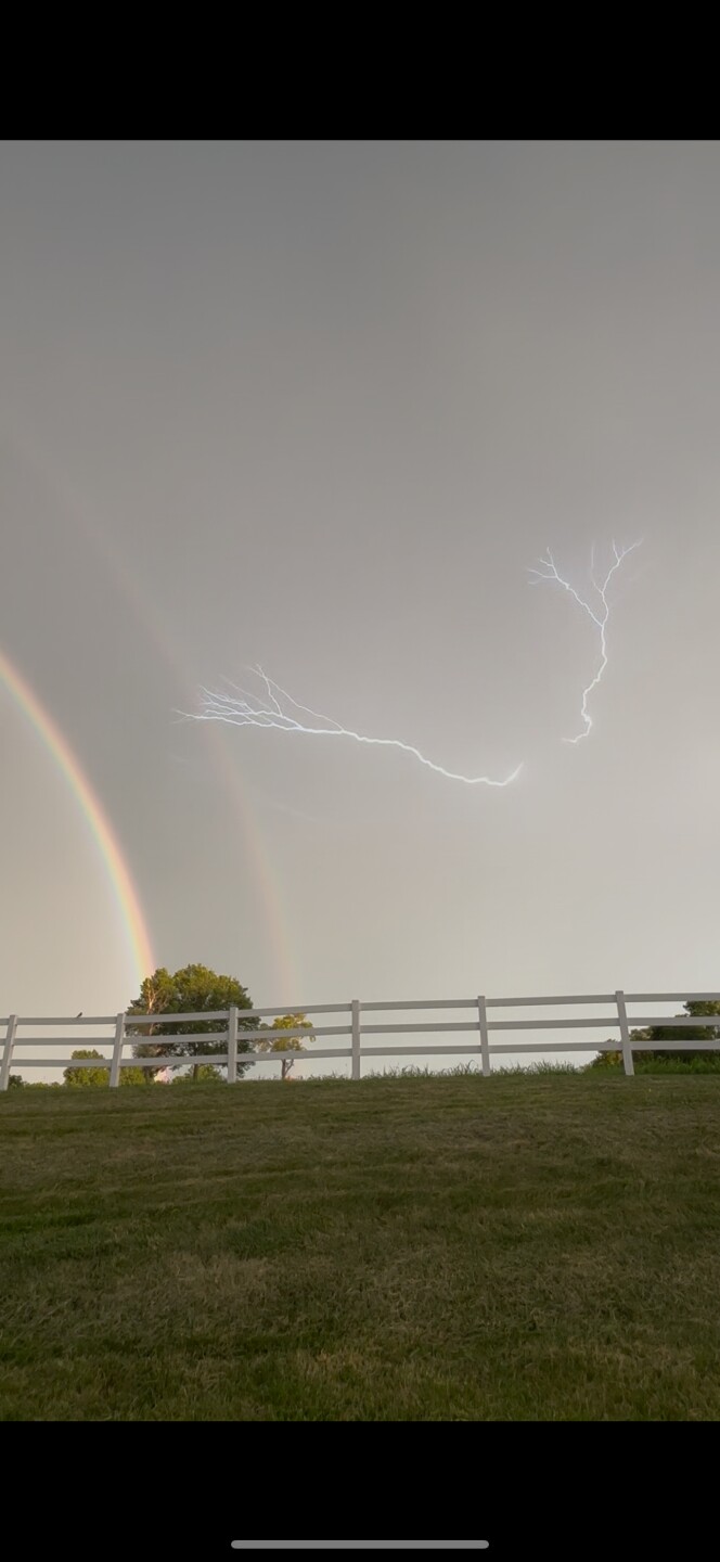 Rainbow and lightning strike