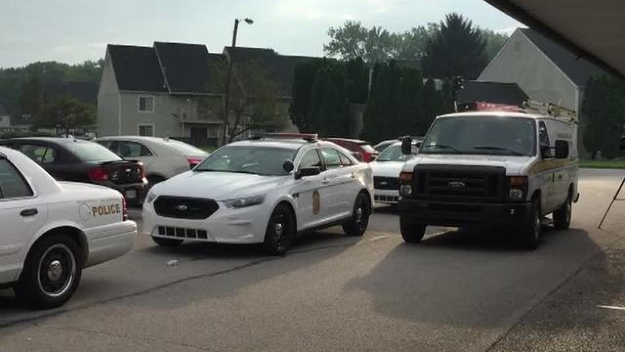 PHOTOS: Police investigating triple homicide