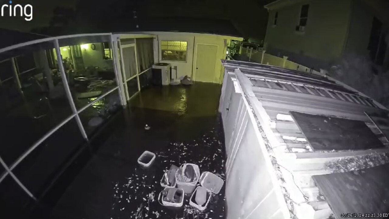 Tearful neighbors contemplate next steps after flooding along Alafia River