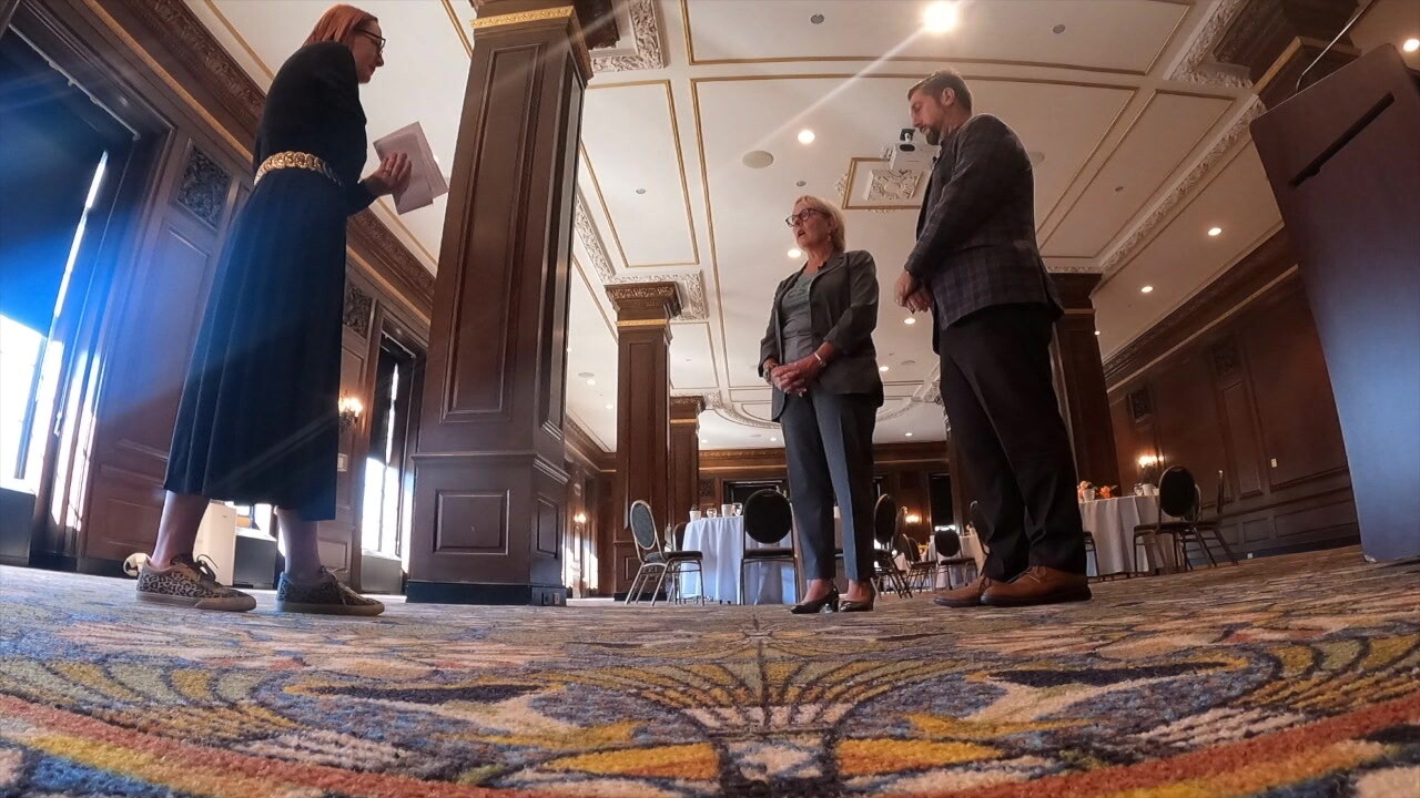News 5 reporter Michelle Jarboe, left, talks to CSU President Laura Bloomberg, center, and Nicholas Vande Velde, from the university's hospitality and facilities team, in the refreshed ballroom at Fenn Tower.