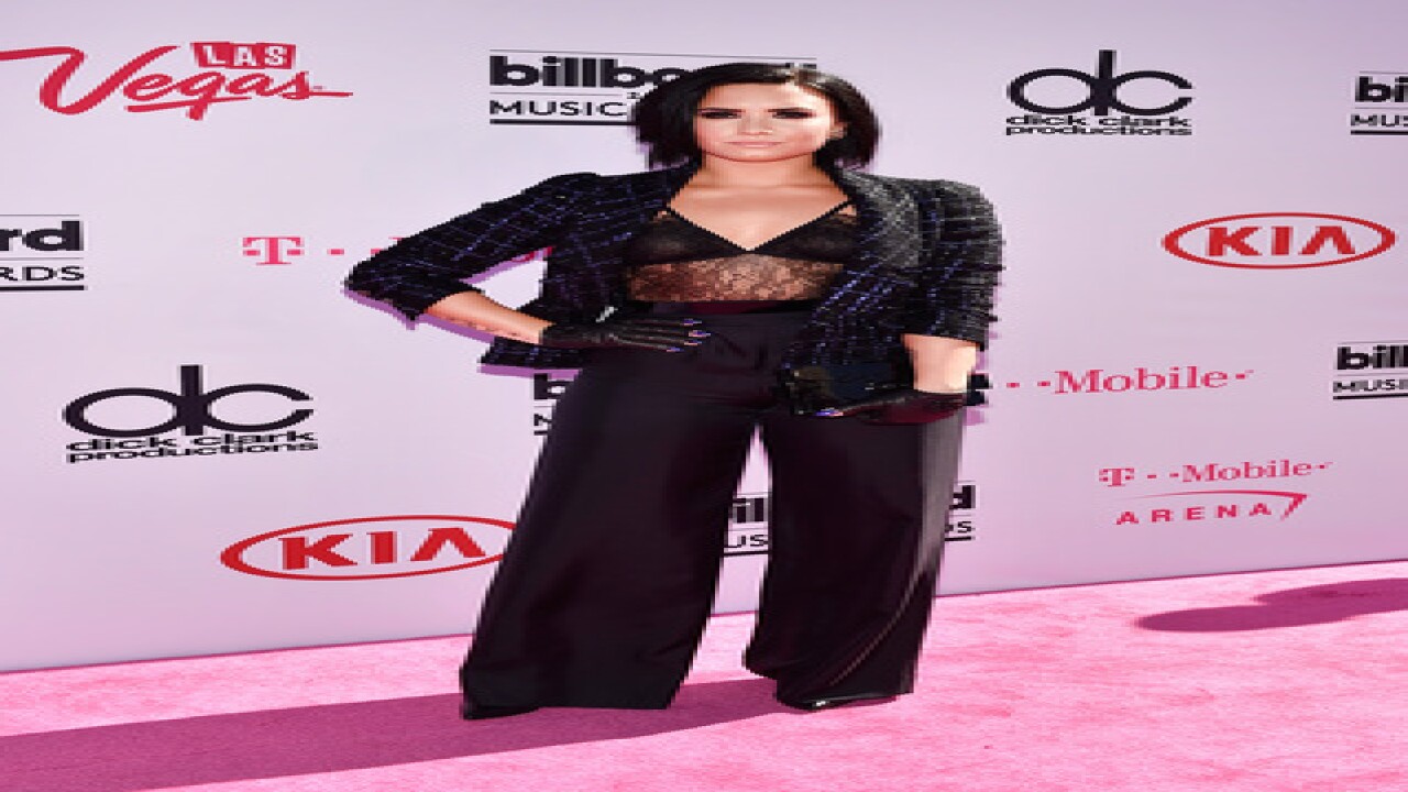 See best, worst looks from BBMA magenta carpet