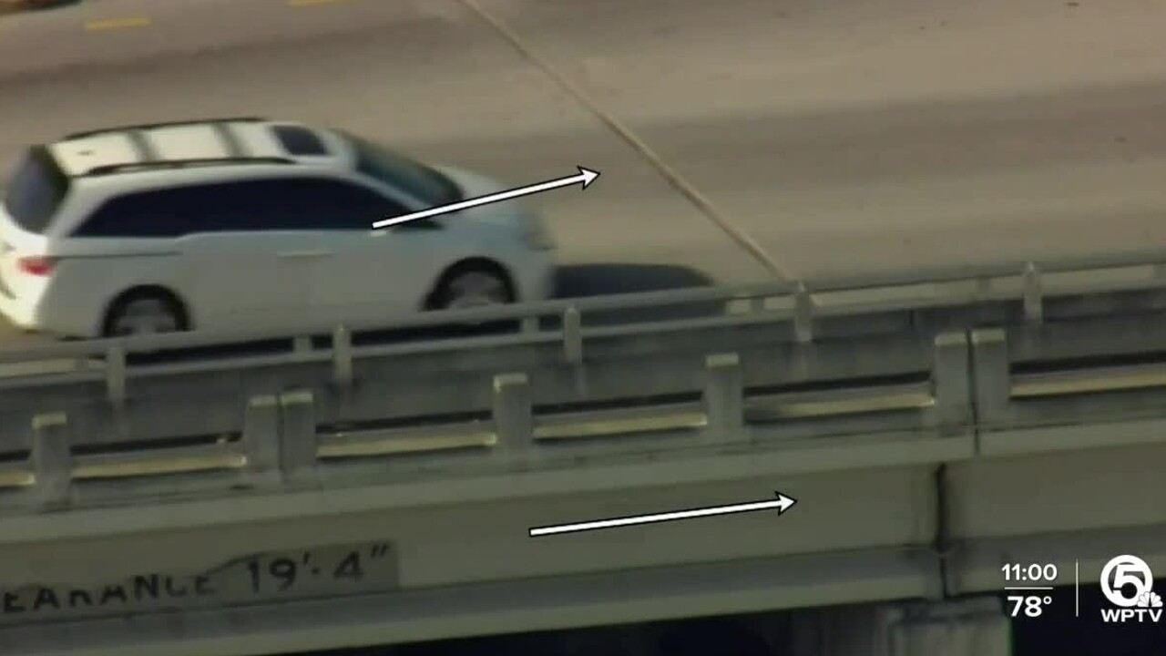 A car approaches a large crack on the 10th Avenue North overpass in Lake Worth Beach on March 30, 2022.jpg