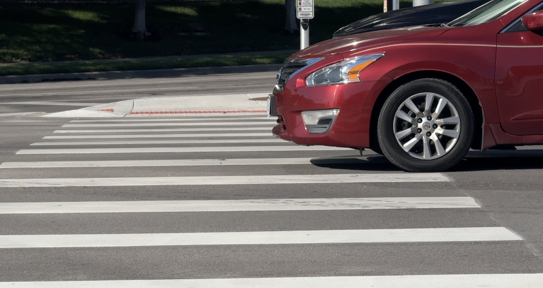 Sedan blocking pedestrian walkway near MLK Boulevard.png