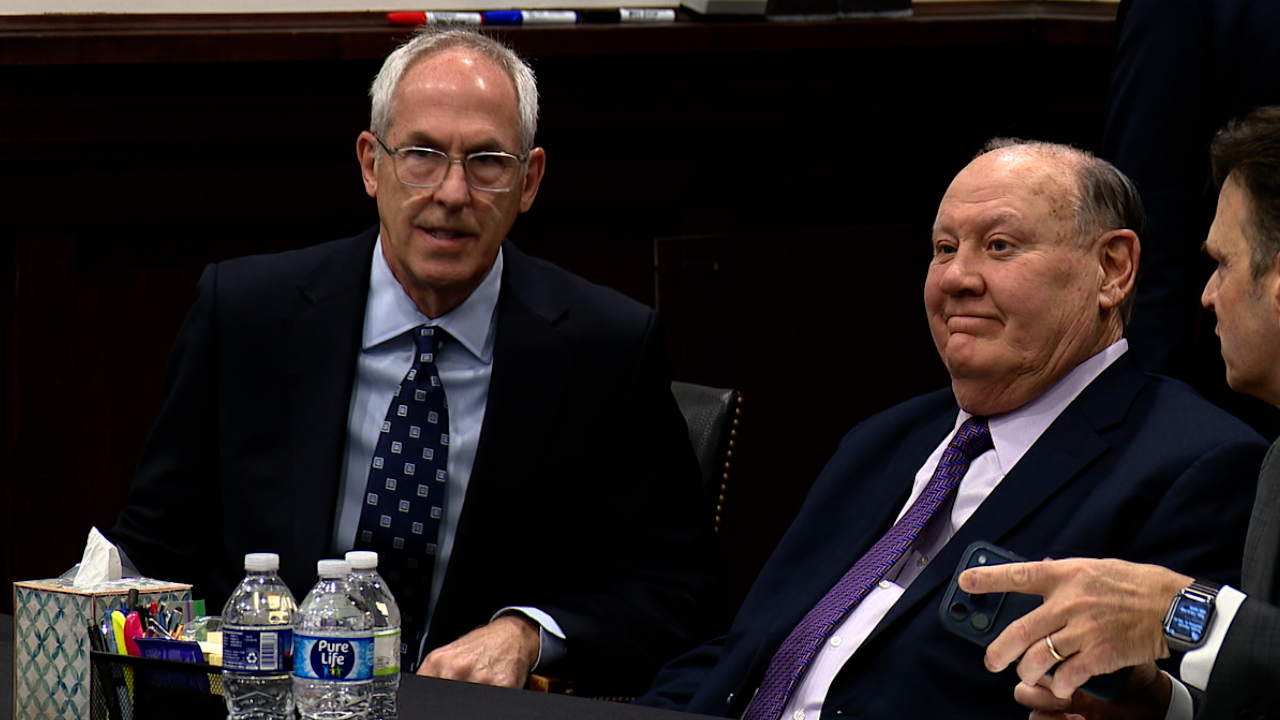 Mike Dowling and Chuck Jones sitting in a Summit County Court of Common Pleas courtroom.
