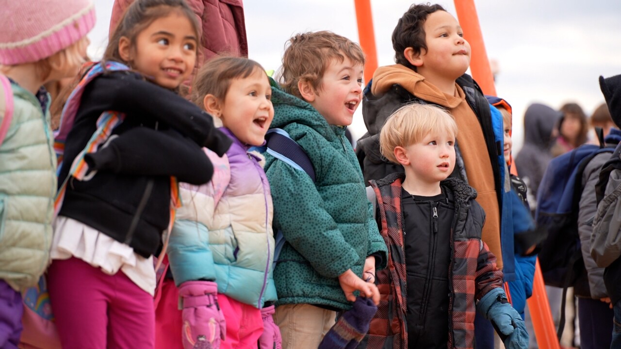 Kids looking at Dr. Randell