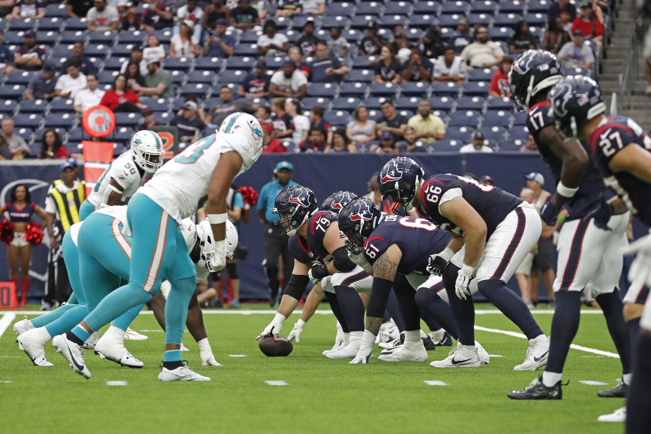 Houston Texans center Jimmy Morrissey and offense lines up against Miami Dolphins defense during Aug. 19, 2023, preseason game