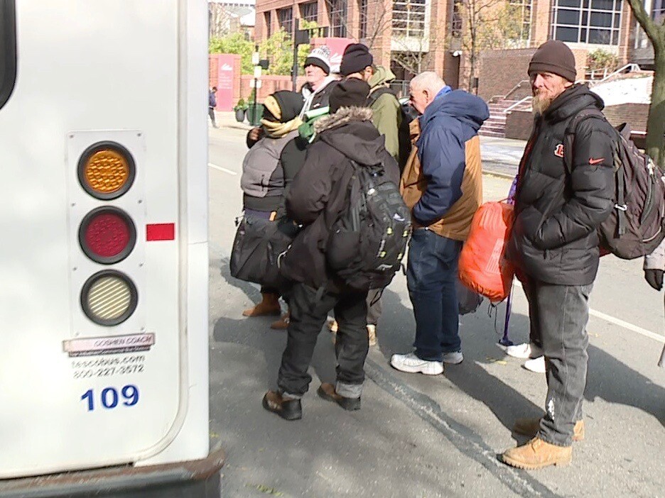 People_lined_up_for_bus.jpg