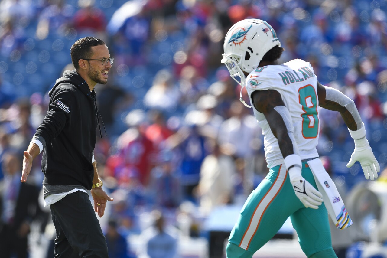 Miami Dolphins head coach Mike McDaniel greets safety Jevon Holland before game at Buffalo Bills, Oct. 1, 2023