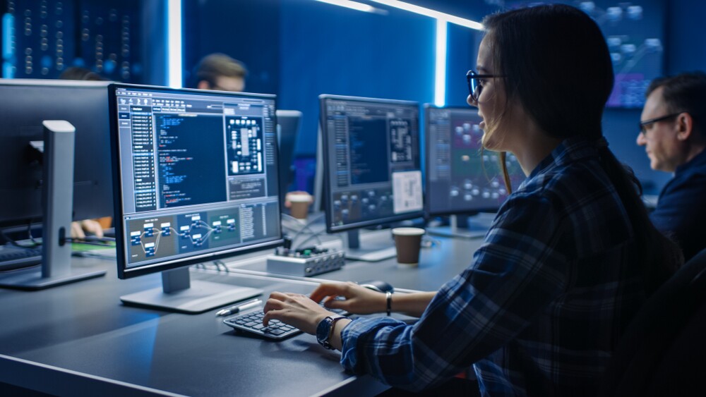 IT worker in a data center system control room