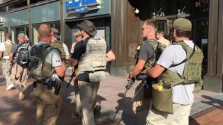 Ohio Minutemen walk through streets of Cleveland.