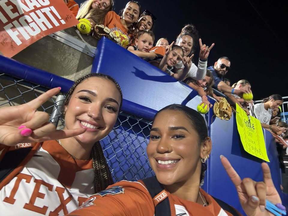 Gonazles family with Vanessa Quiroga at Women's College World Series