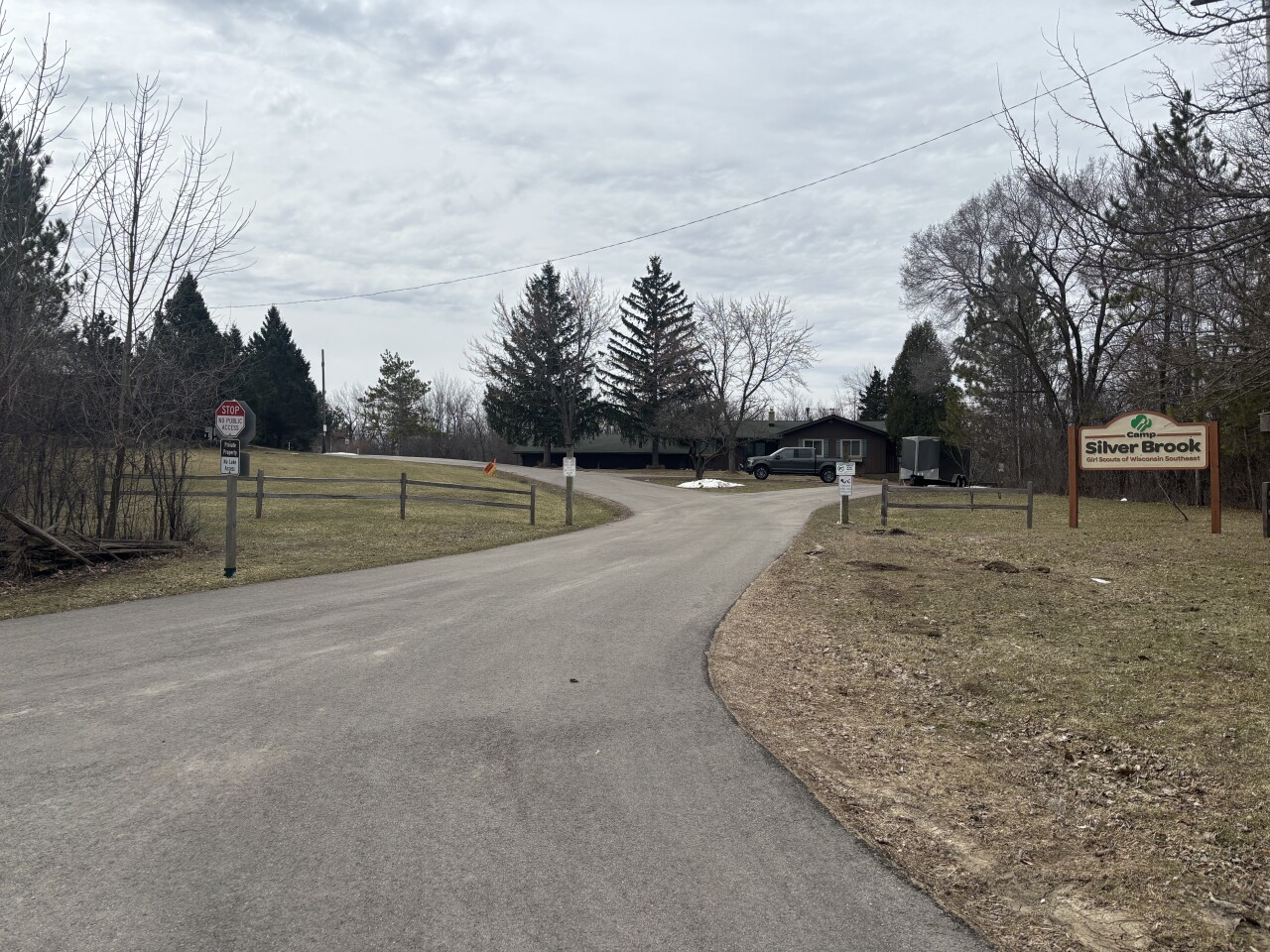 Community members want answers after a man living at a Girl Scout camp faces gun and drug charges