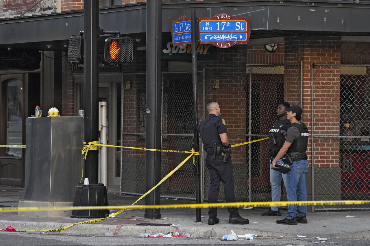 Police officers stand in Ybor City section of Tampa after shooting, Oct. 29, 2023
