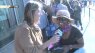 Woman reads scriptures at Nordstrom Rack opening