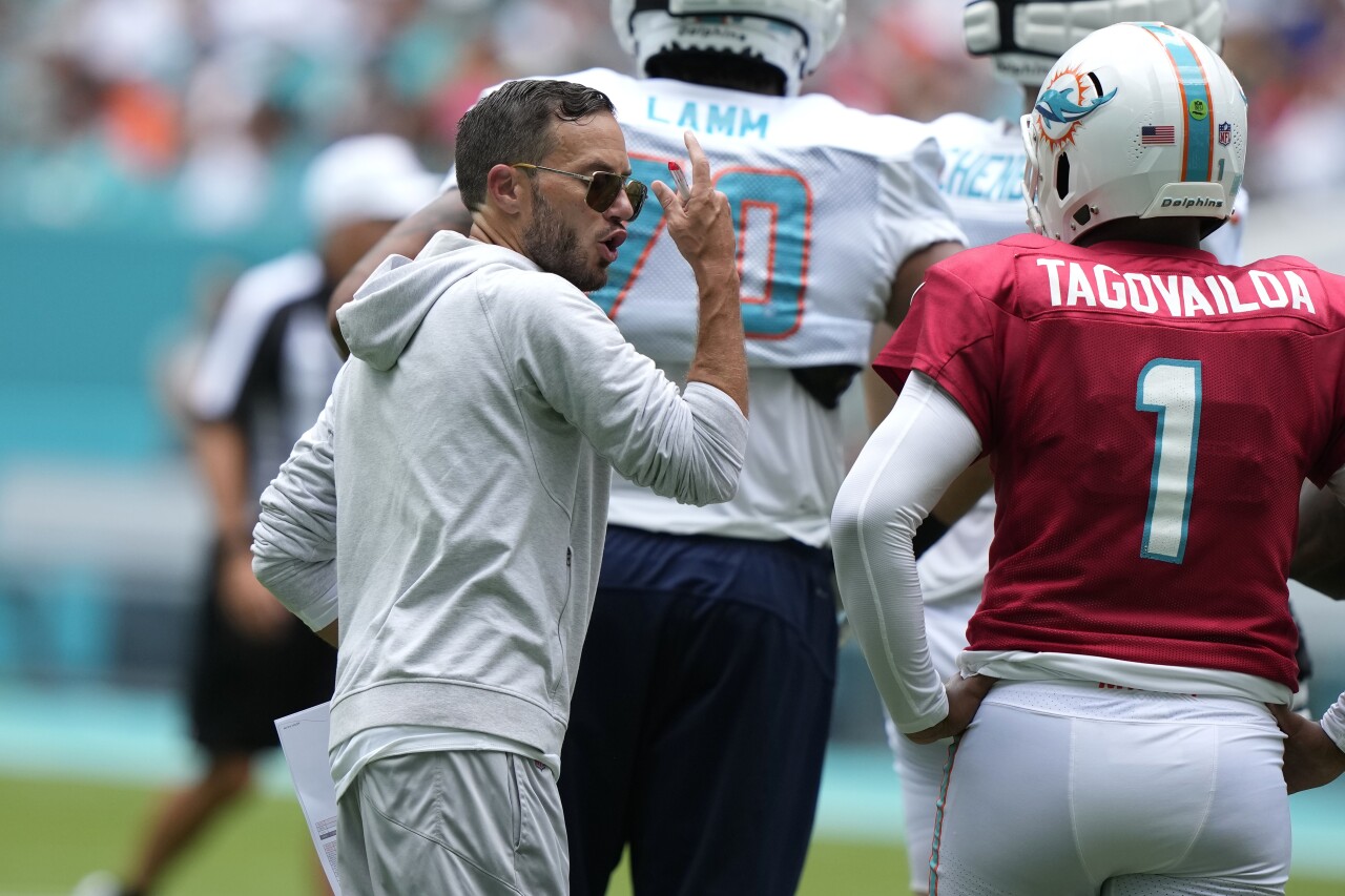 Miami Dolphins head coach Mike McDaniel speaks to QB Tua Tagovailoa during Hard Rock Stadium scrimmage, Aug. 5, 2023