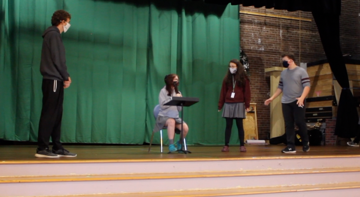 Students have to wear masks and social distance on stage