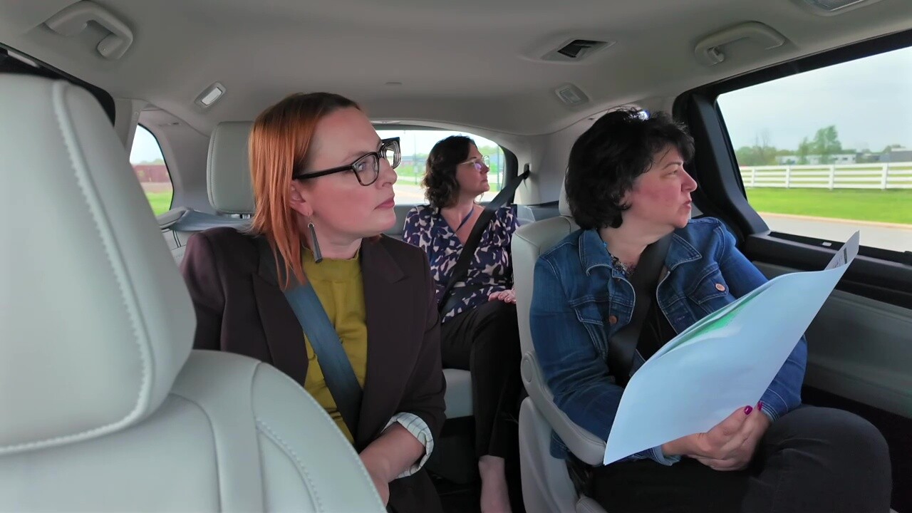 News 5 reporter Michelle Jarboe, left, takes a driving tour of the New Albany International Business Park with members of the city's community development team.