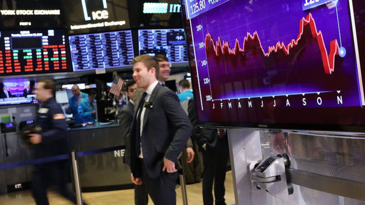 Dow falls 300 points, dragged down by more Apple woes