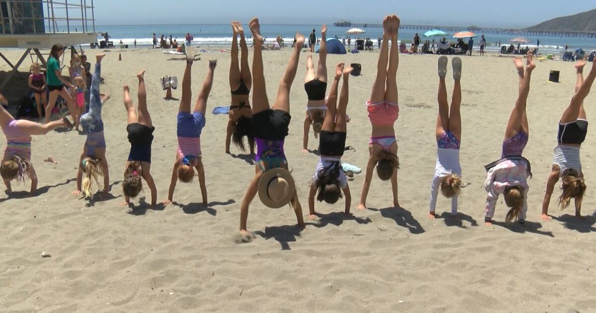 Young gymnasts, inspired by Olympics, show off their skills at the beach