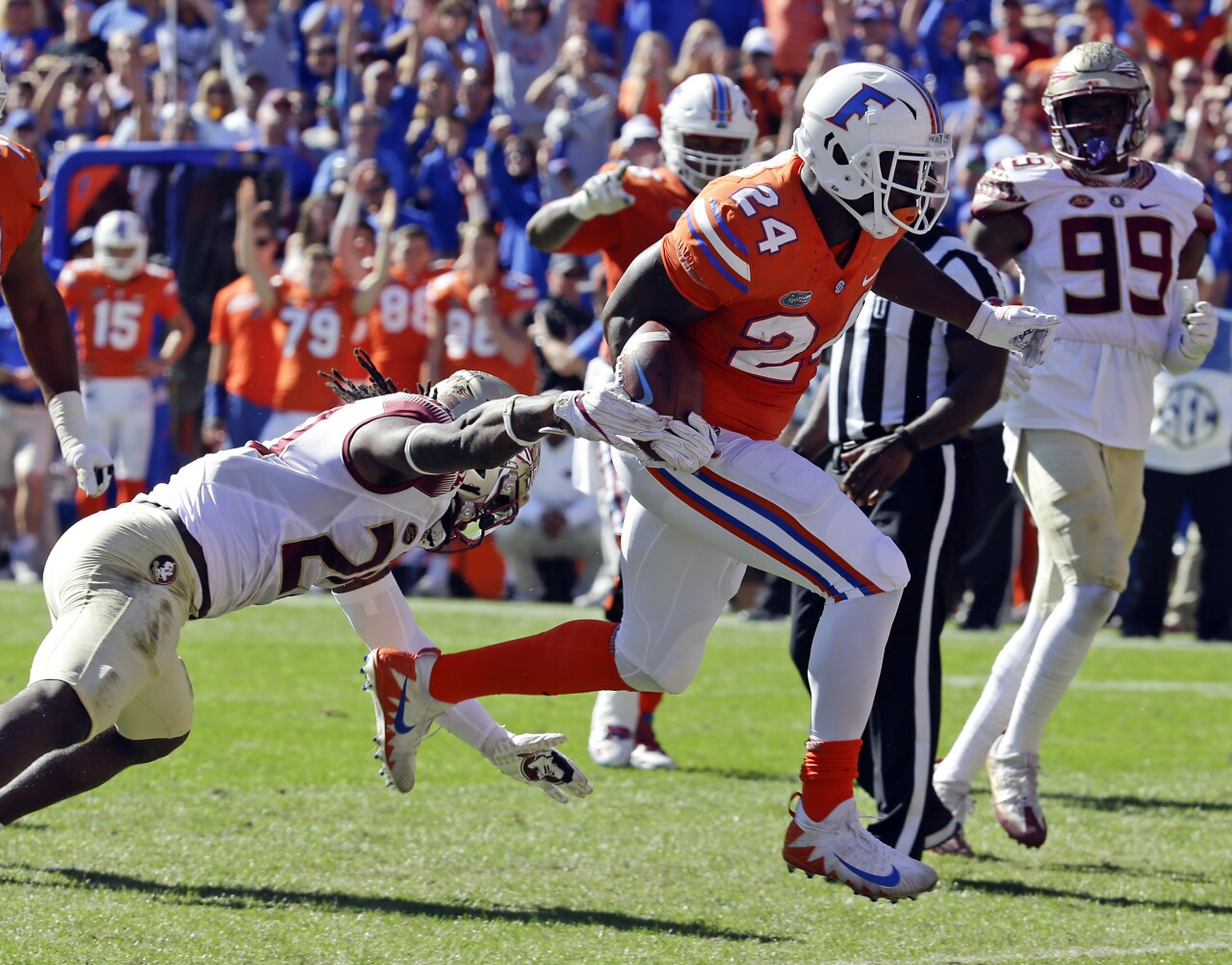 Florida Gators running back Mark Thompson scores 24-yard TD past Florida State Seminoles safety Trey Marshall in 2017
