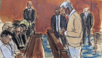 In this courtroom sketch, Sean "Diddy" Combs, rights, leads his family in a prayer before the verdict was read, convicting him of prostitution-related offenses but acquitting him of sex trafficking and racketeering charges, Wednesday, July 2, 2025, in Manhattan federal court in New York.