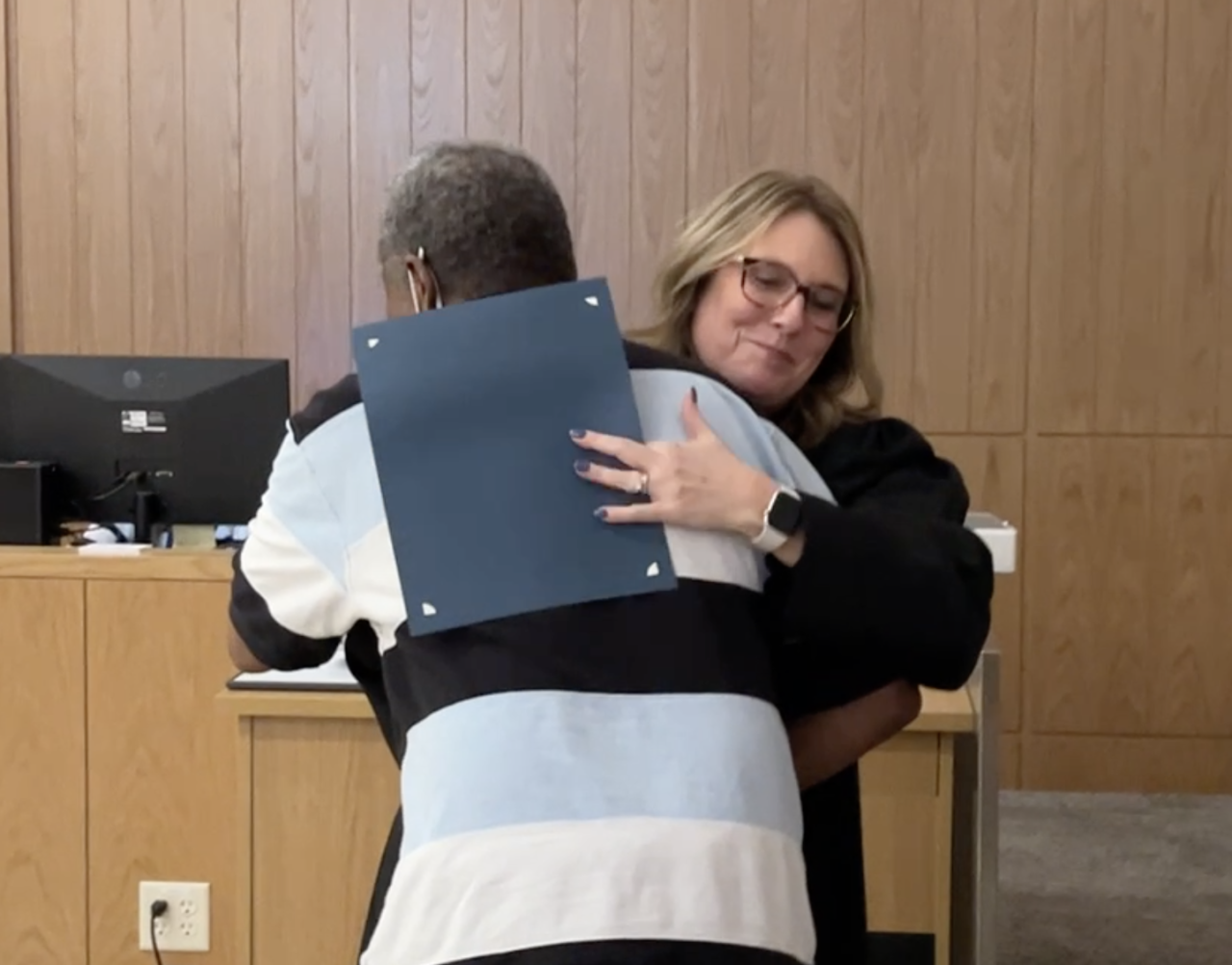 Judge Jones hugs Myron Foster.png