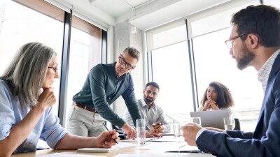 Stock image of a business meeting in an office.