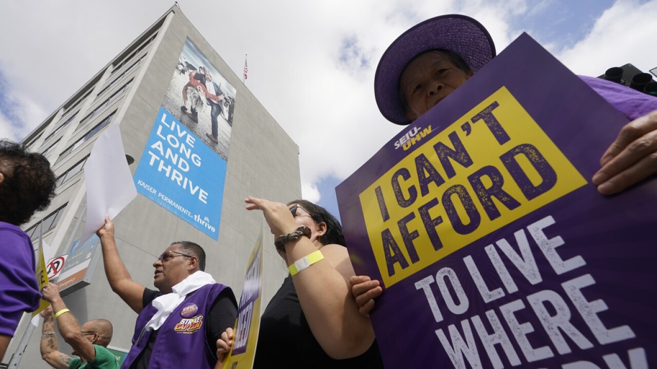 Frontline healthcare workers hold a demonstration.