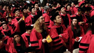 Harvard University students attend commencement ceremonies.