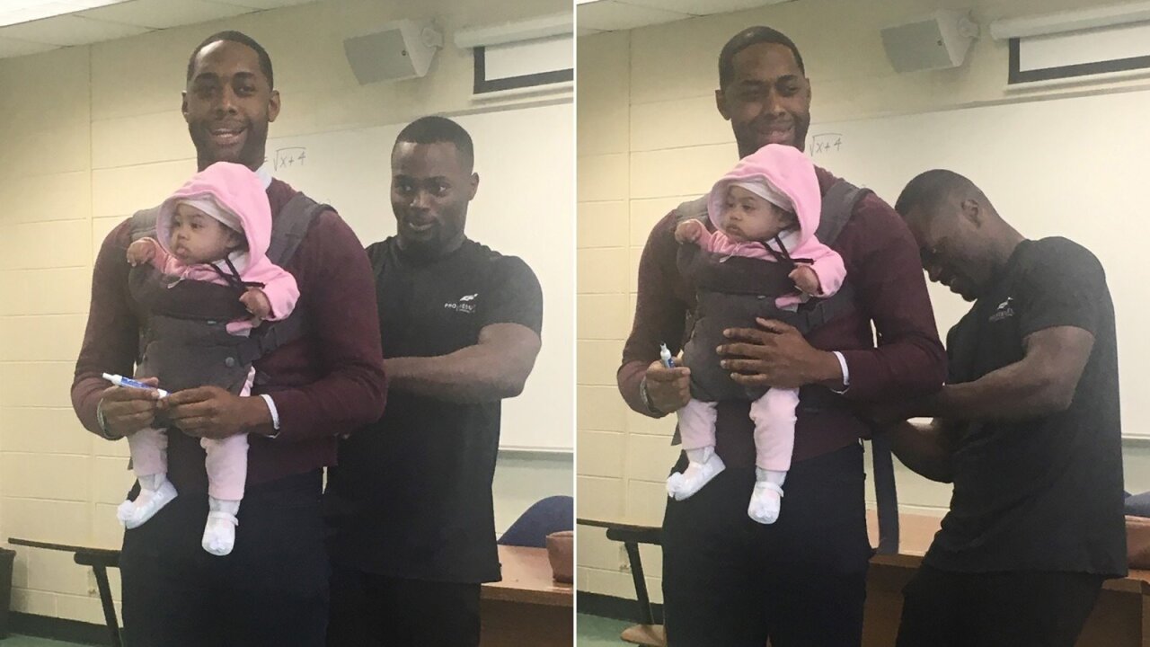 Professor holds baby