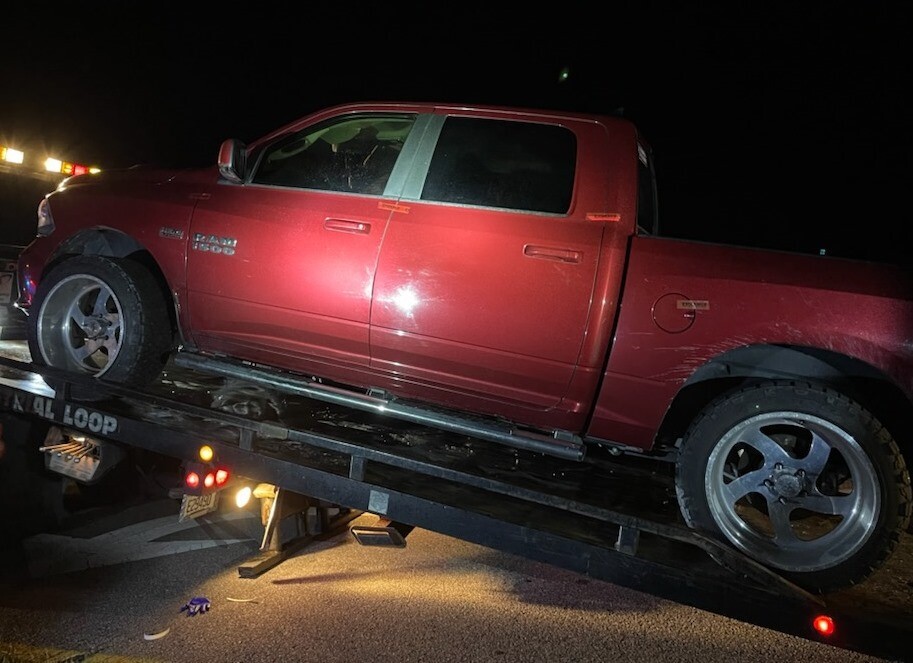 Suspect's Dodge Ram pick-up truck being towed