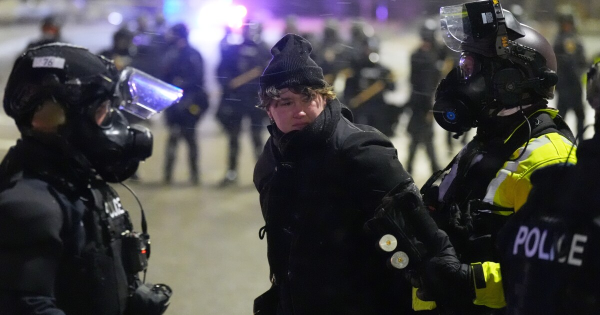 Police arrest protesters outside Minnesota hotel believed to house ICE agents