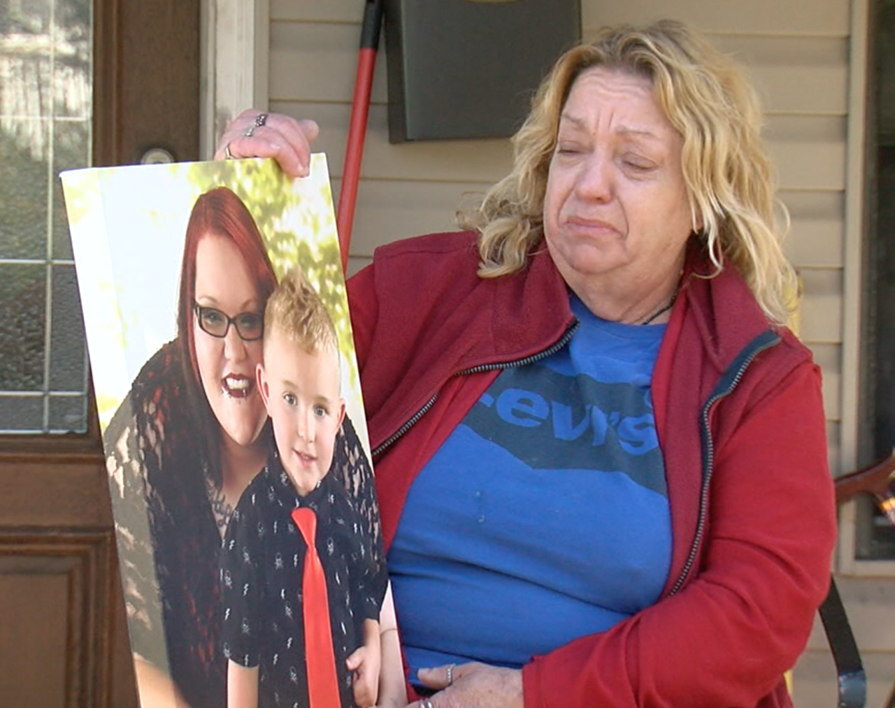 Bertie Keaton holds a photo of her daughter, Jessica England, and England's son, Xaiden