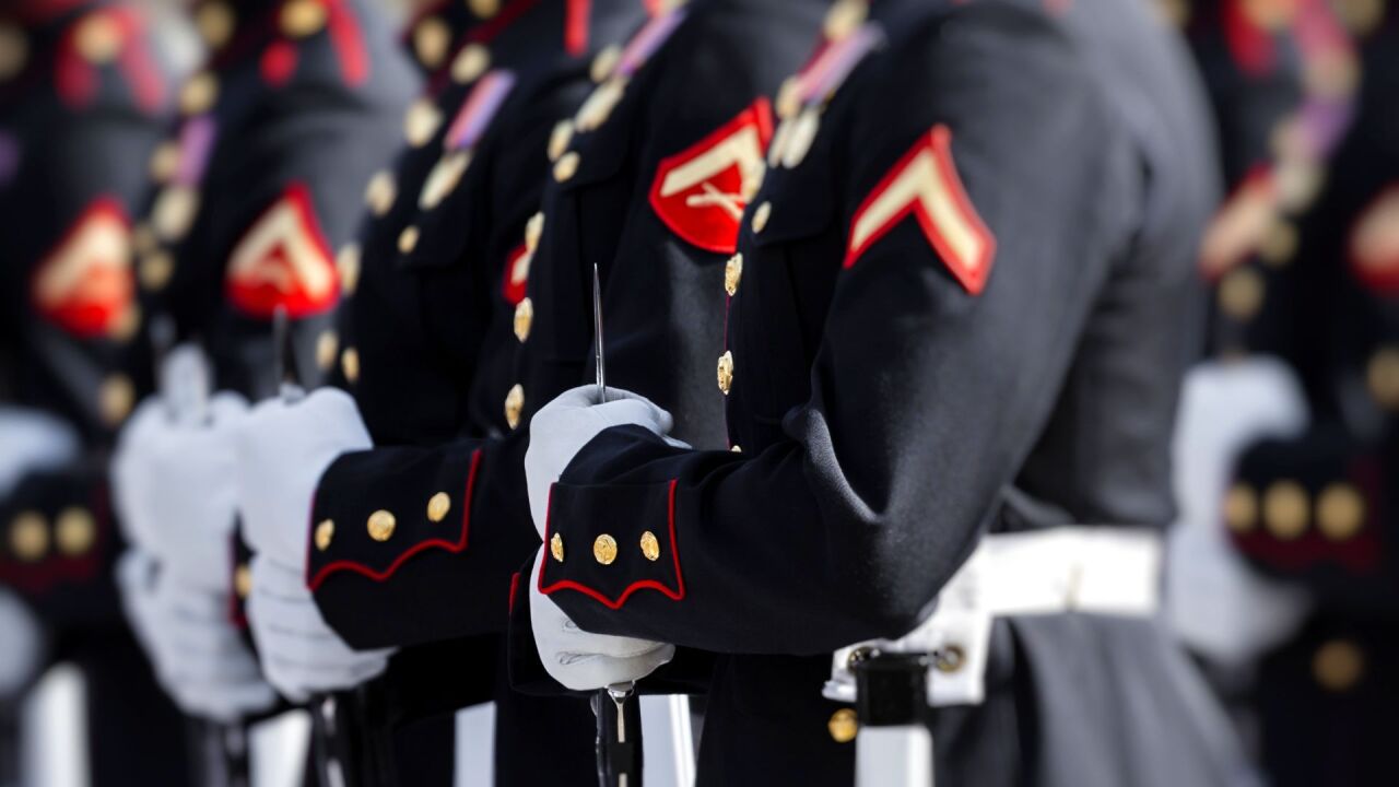 Stock image shows U.S. Marines in uniform.