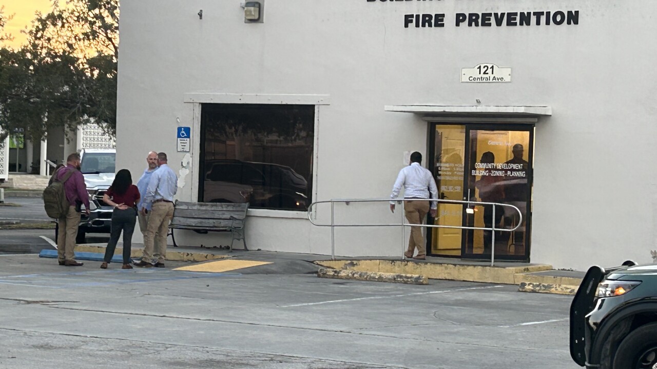 Investigators raid the Clewiston Community Development Building. 