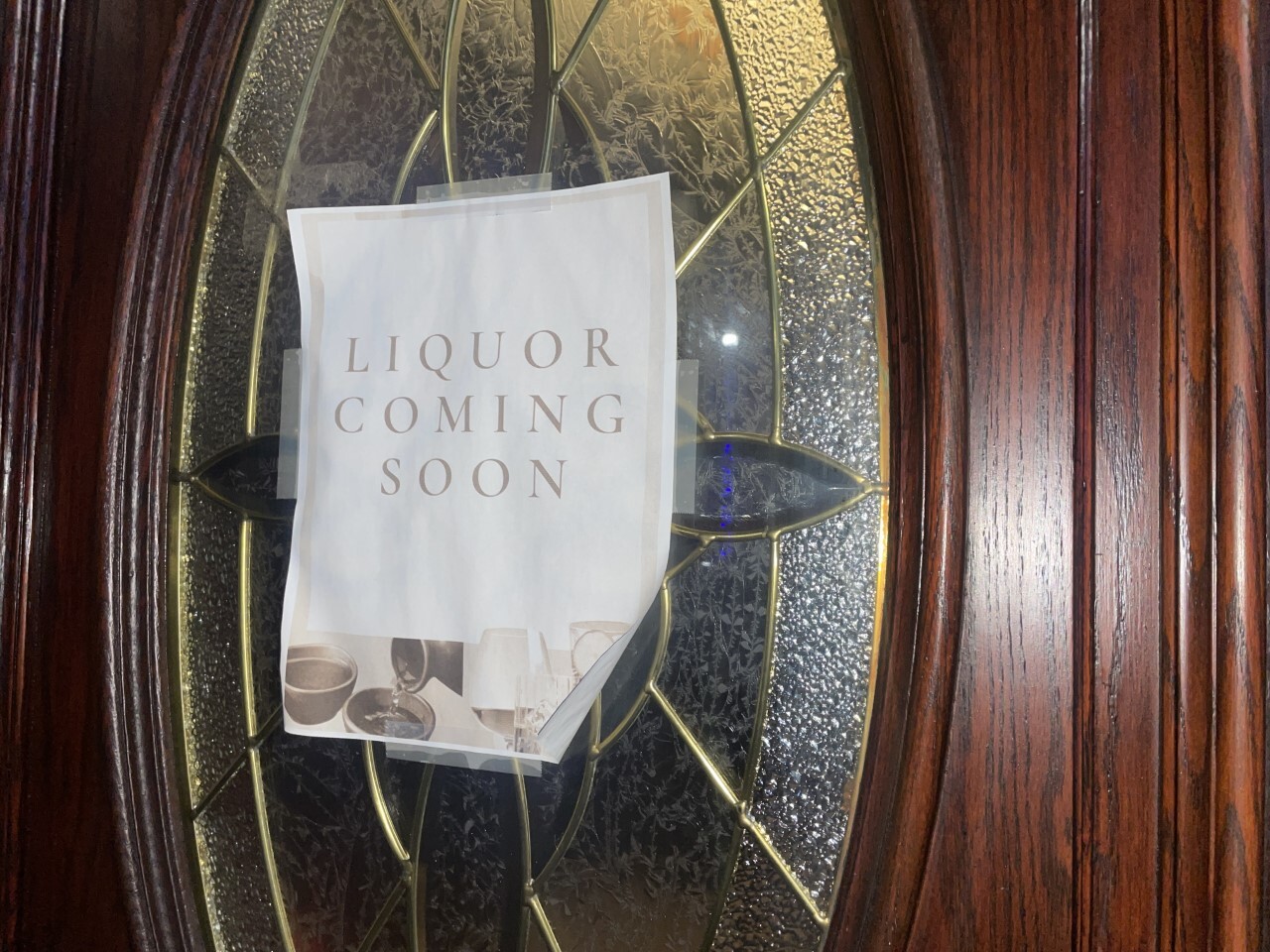 Soho Sushi in downtown Grand Rapids has had this "Liquor Coming Soon" sign on their front door for weeks
