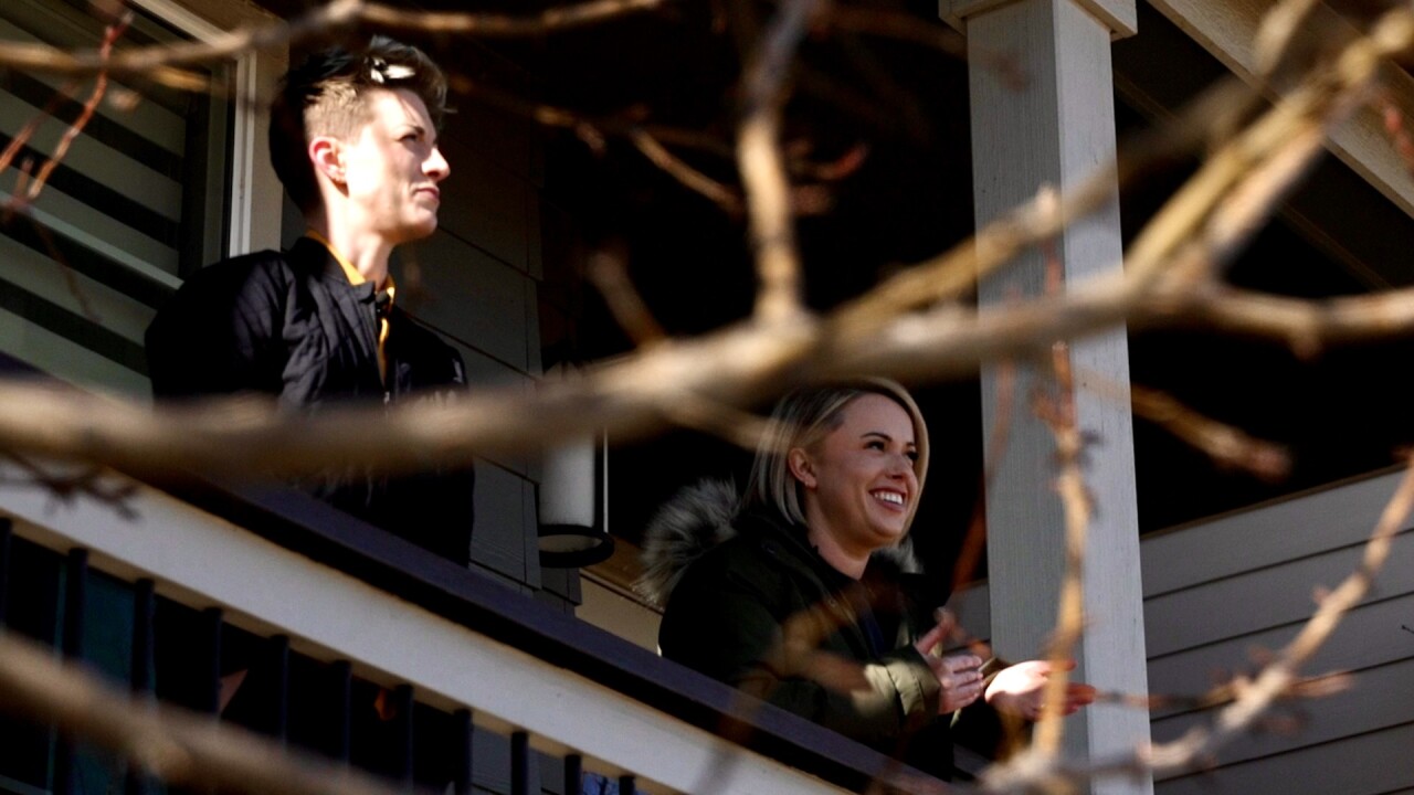 Spencer and Kelly looking out their porch.jpg