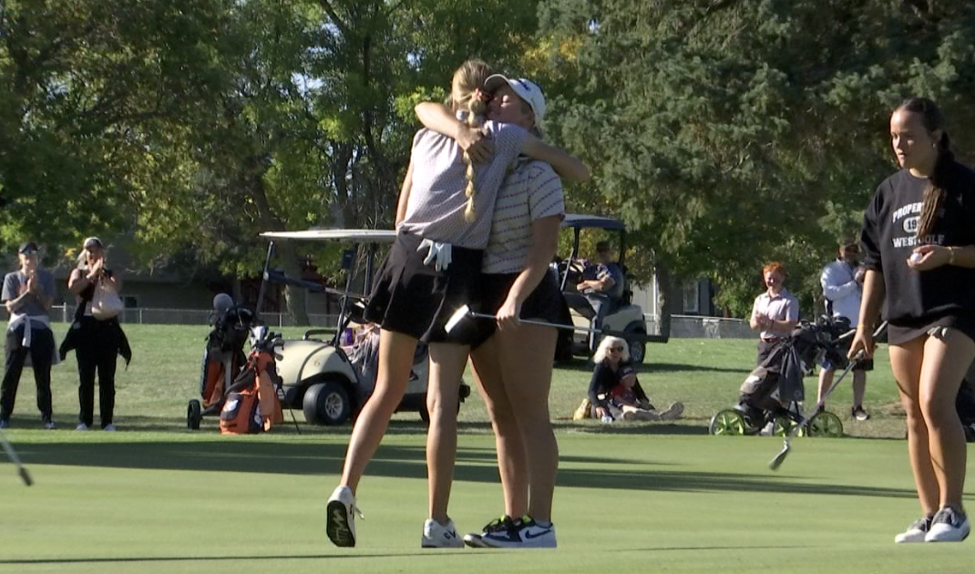 Kenzie and Bella Johnson share a hug.png