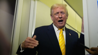 President Donald Trump speaks to reporters on Air Force One on his way to his Mar-a-Lago estate in Palm Beach, Fla., Friday, Nov. 14, 2025.