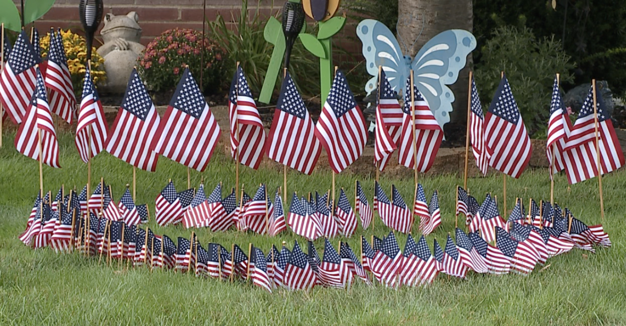 13 flags representing the men and women lost in attack in Kabul