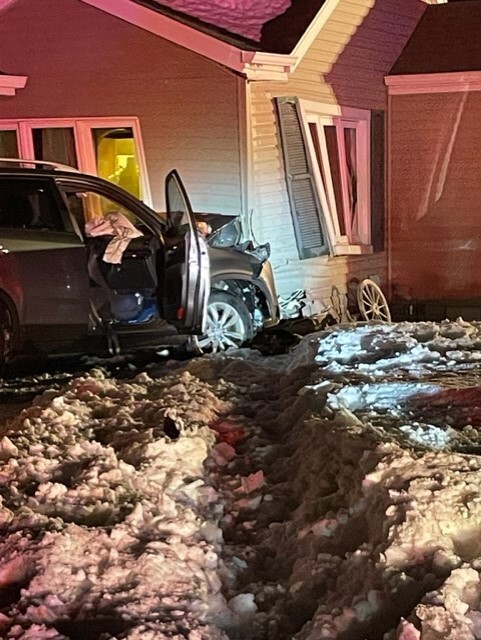 Driver crashes into home