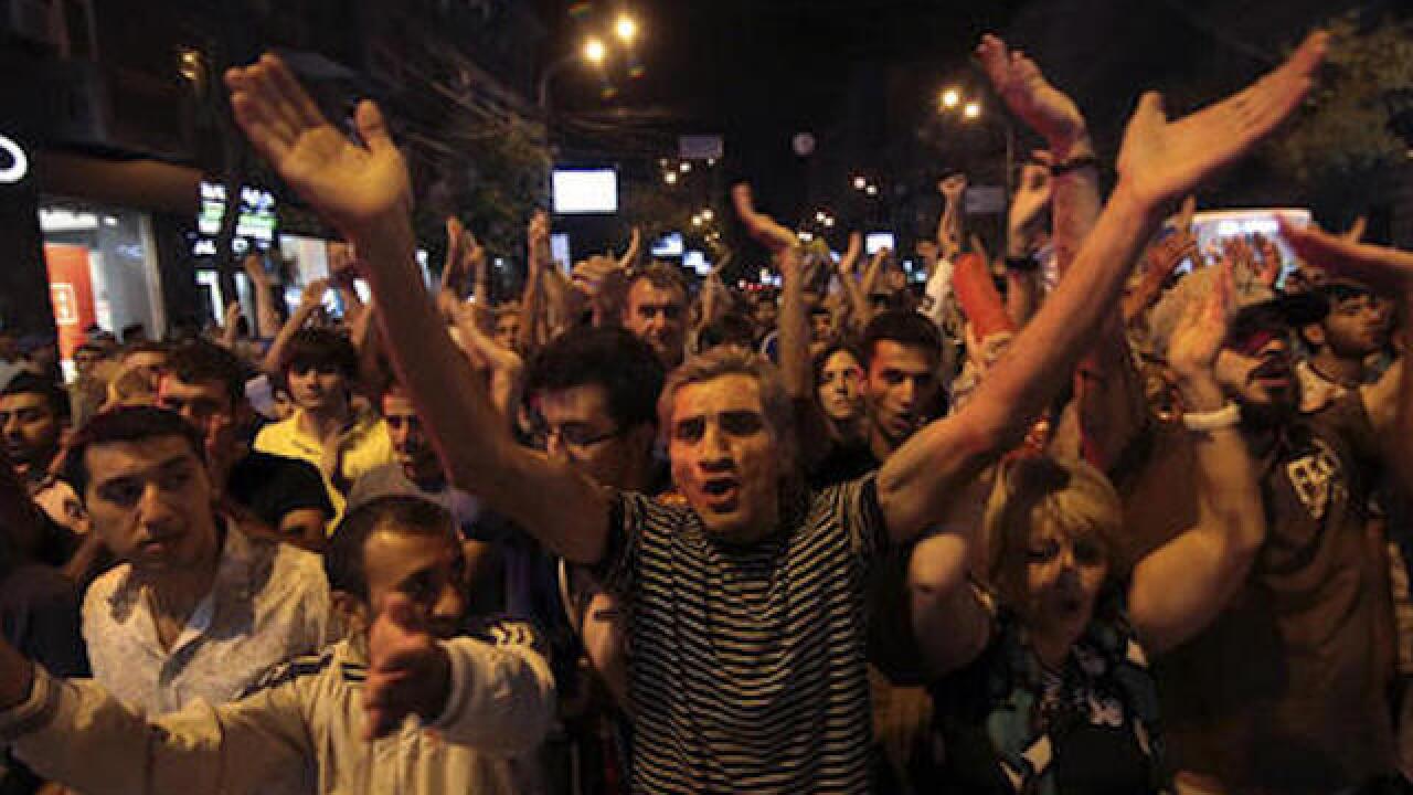 Armenian gunmen surrender, standoff ends with two police officers killed