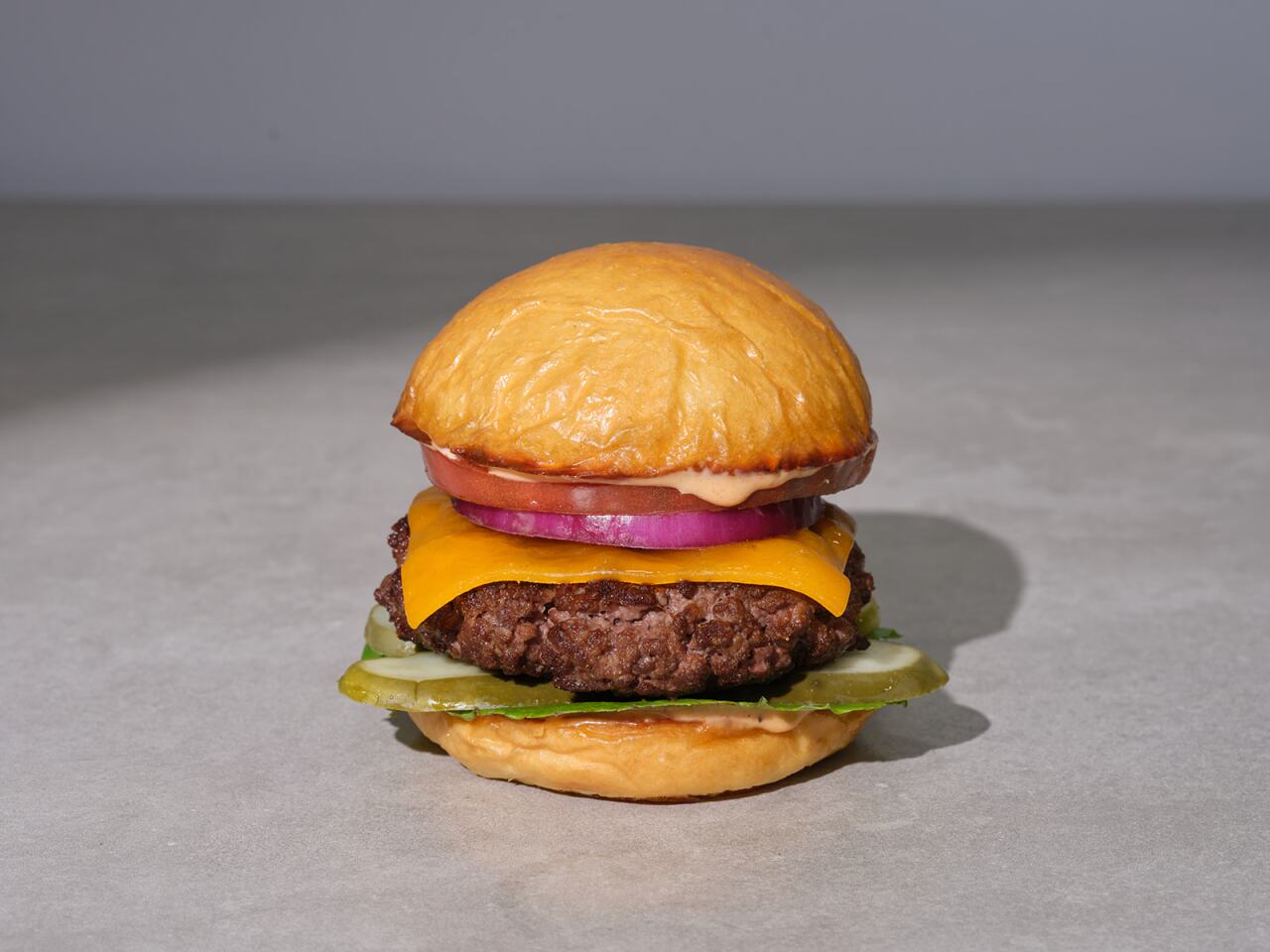 Photo features 'Angie's USDA Prime Steakhouse Cheese Burger - Hand Sliced Sharp Cheddar Cheese.'