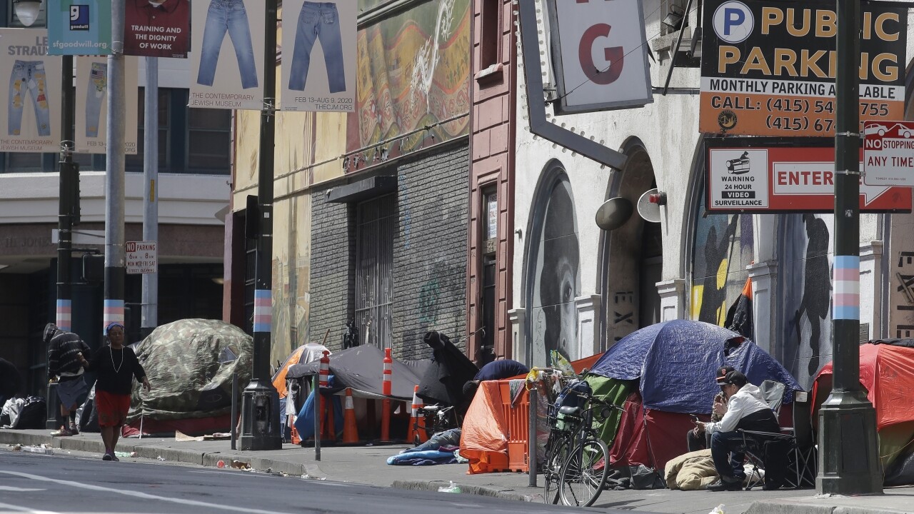 Tents line a sidewalk