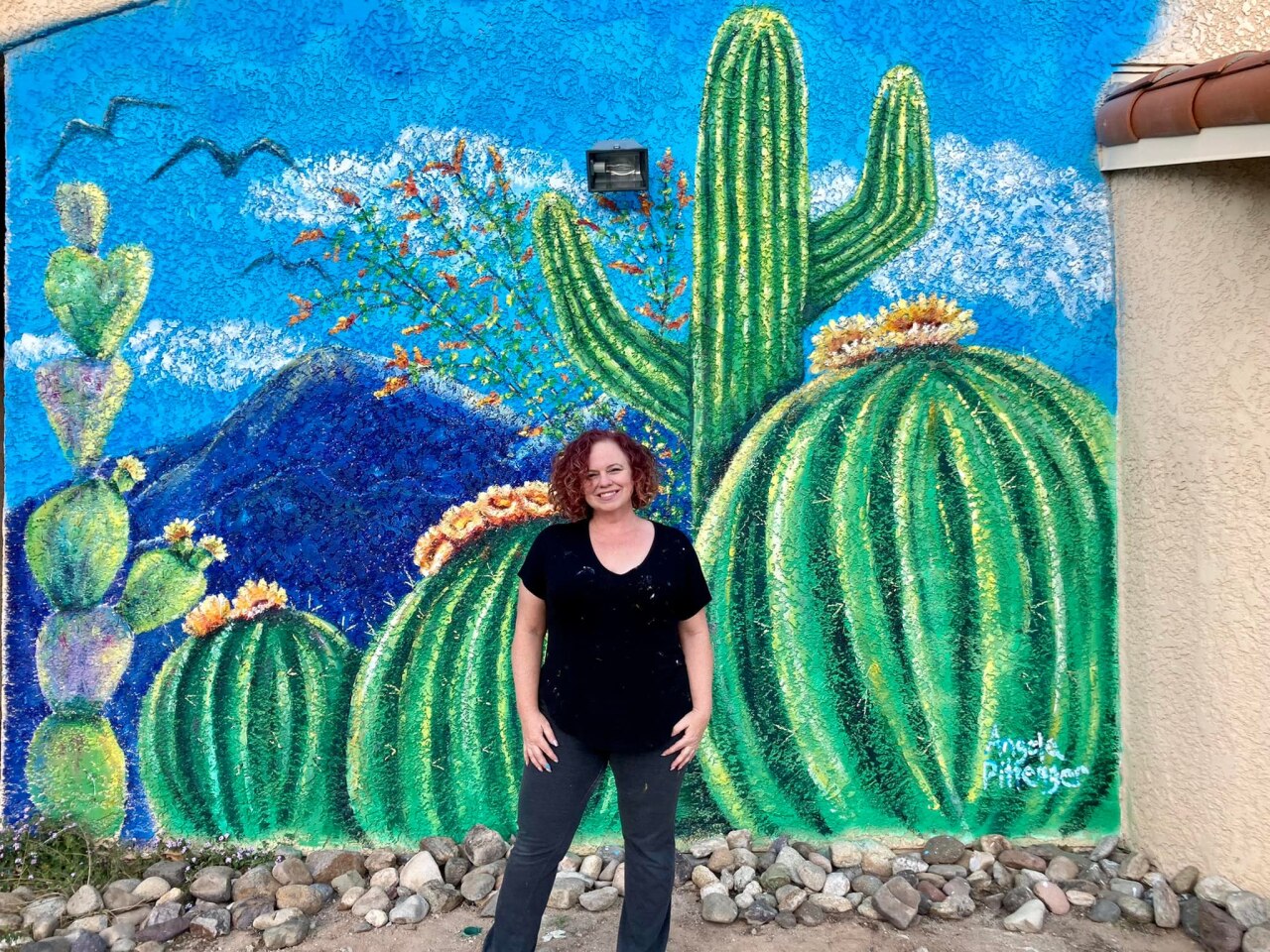 Angela Pittenger stands in front of one of her latest creations