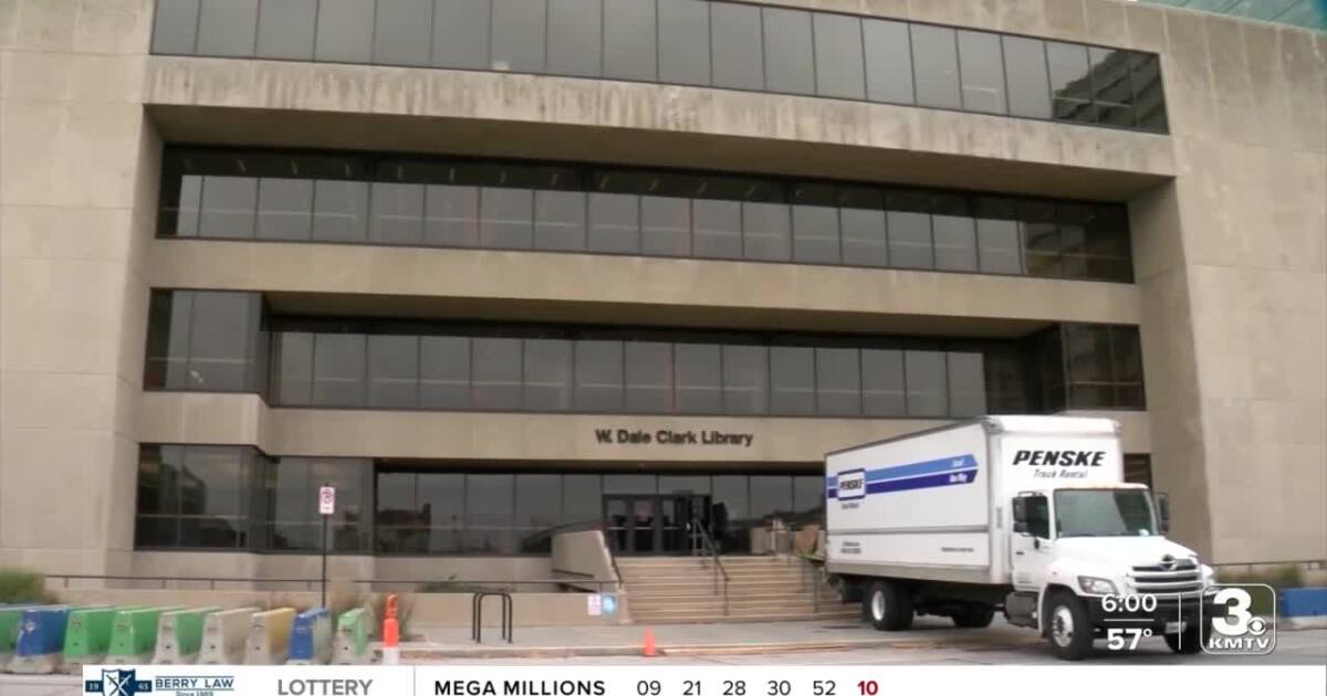 Library admin building still under construction as contents are moved in