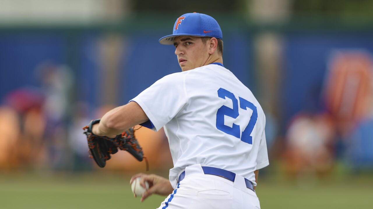 Florida Gators pitcher Fisher Jameson warms up before game, June 2, 2023