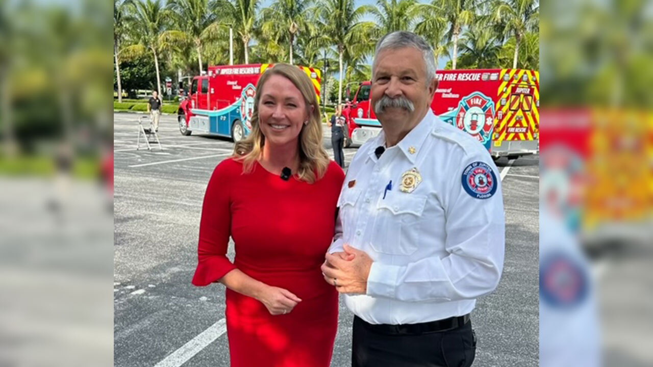 Ashley Glass connecting with Jupiter Fire Chief