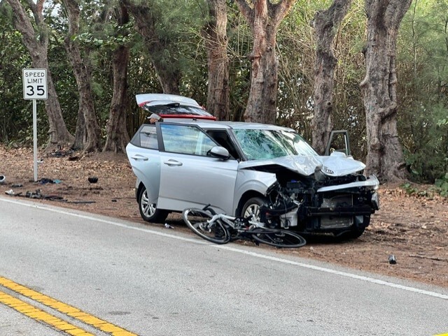 Delray Beach police respond to a crash between a car and group of cyclists on North Ocean Boulevard, right in front of Gulf Stream Golf Club, on Jan. 4, 2024.jpg